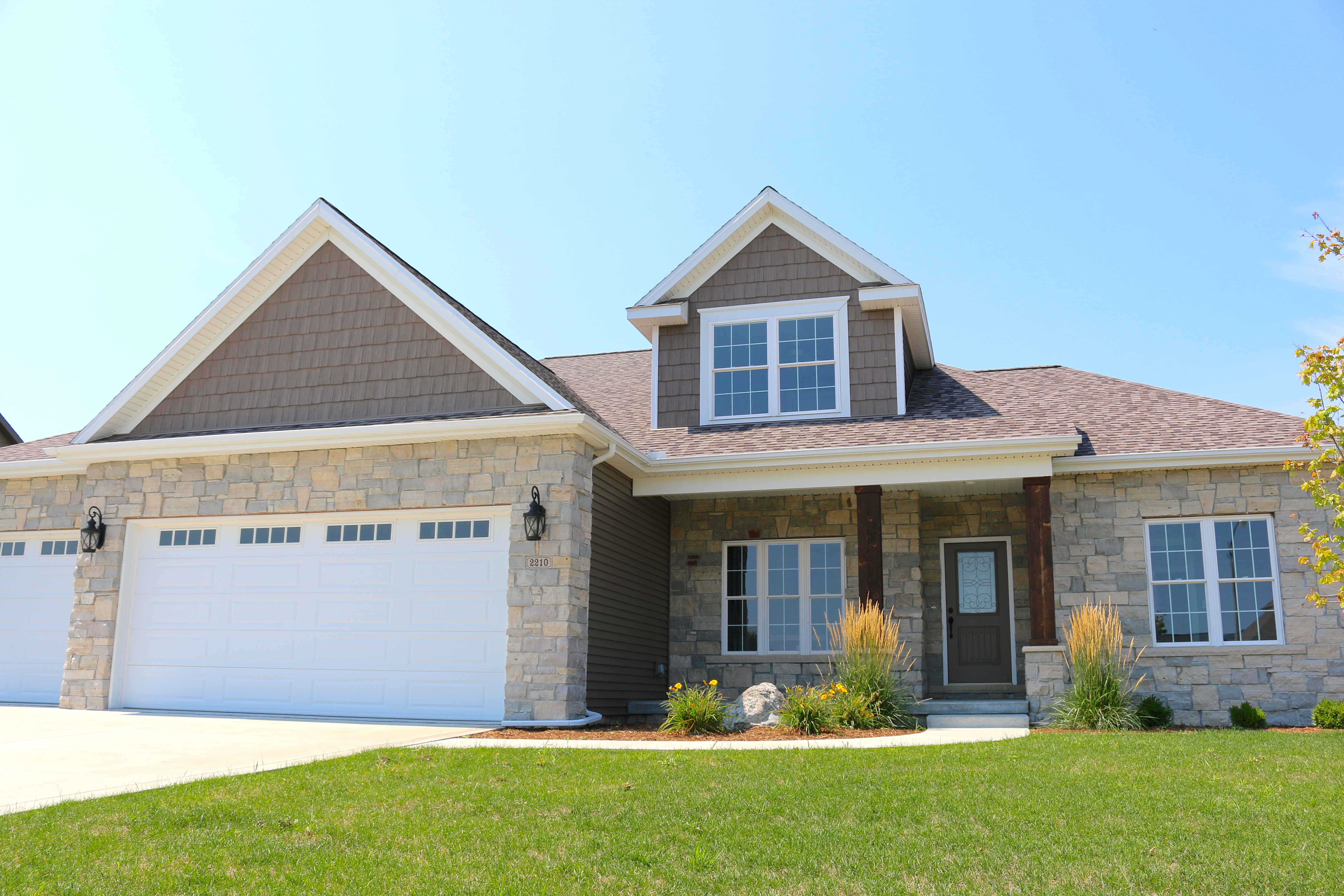 Mastic Montana Suede dark brown siding and shakes with whtie trim and  Mission Brown shingles in Bloomington IL – Carlson Exteriors Inc., image size:5472x3648